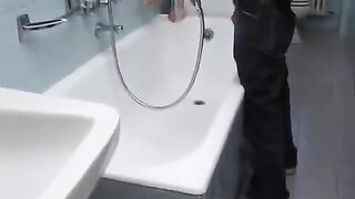 Brunette curvy sexy milf sucking off a boy in the toilet